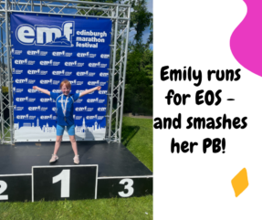 Girl on podium pf EMF after raising money for EOS
